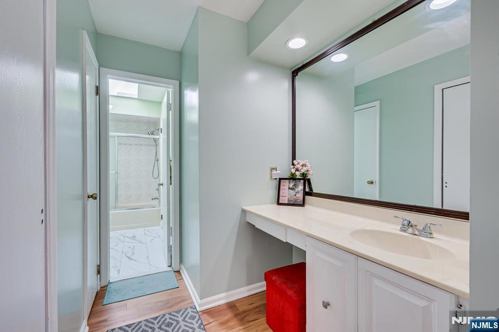 1402 Maplecrest Road, Unit 1402 Edison, NJ 08820 - Photo 28 of 37 a bathroom with a sink and a mirror