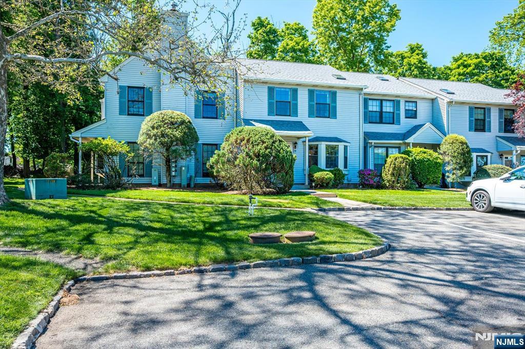1402 Maplecrest Road, Unit 1402 Edison, NJ 08820 - Photo 3 of 37 a front view of house with yard and green space