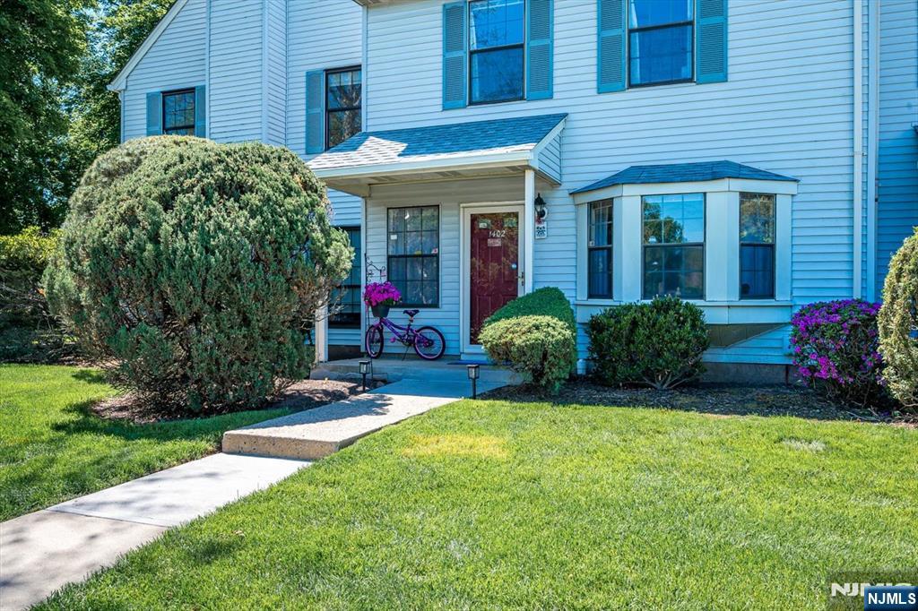 1402 Maplecrest Road, Unit 1402 Edison, NJ 08820 - Photo 5 of 37 a view of a house with backyard garden and porch