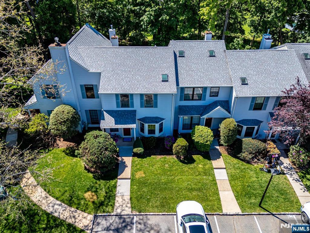 1402 Maplecrest Road, Unit 1402 Edison, NJ 08820 - Photo 6 of 37 front view of house with a yard
