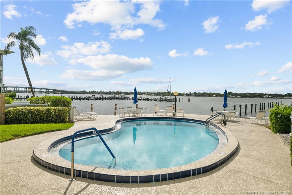 Undisclosed Address Stuart, FL 34994 - Photo 29 of 43 a view of a swimming pool with a lounge chairs