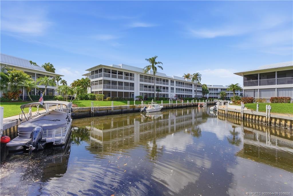 Undisclosed Address Stuart, FL 34994 - Photo 32 of 43 a view of a lake with a table and chairs