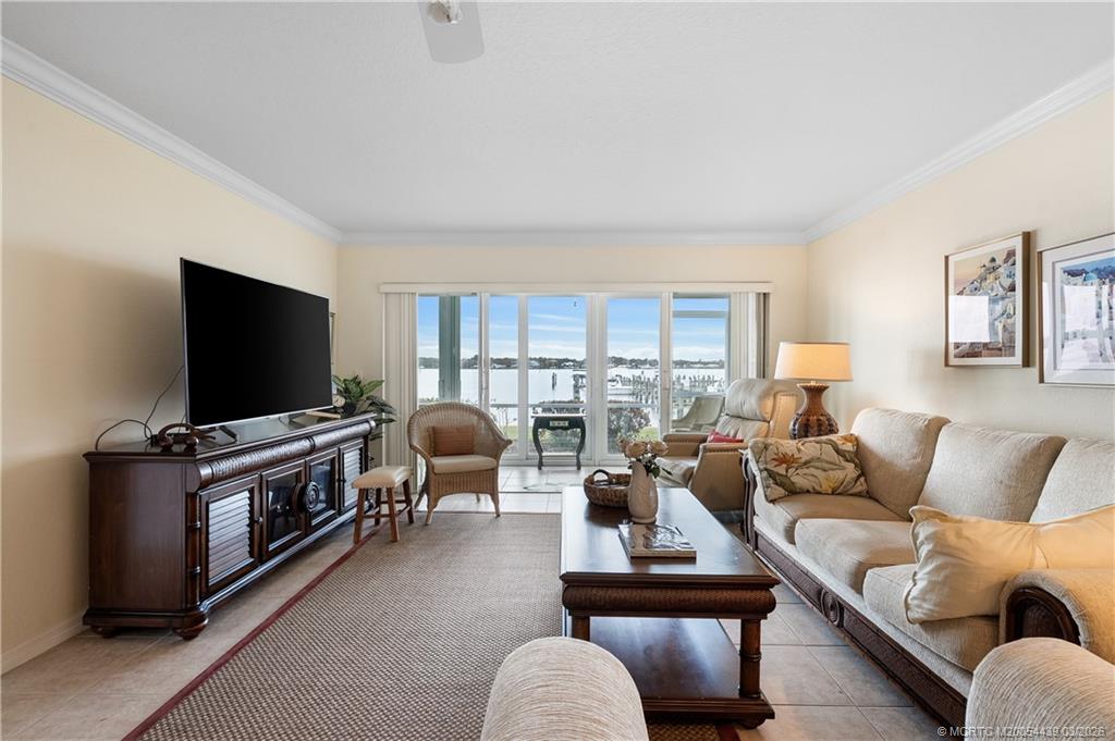 Undisclosed Address Stuart, FL 34994 - Photo 8 of 43 a living room with furniture and a flat screen tv