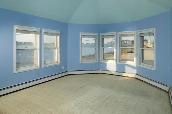 an empty room with windows