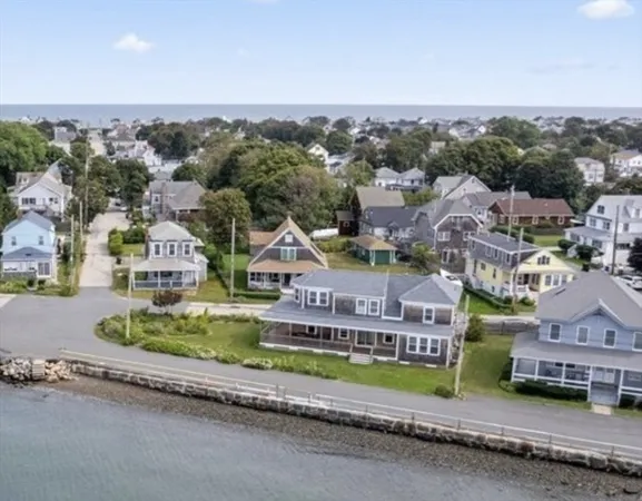 an aerial view of houses with a street