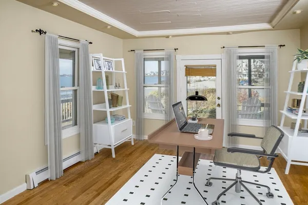 a room with wooden floor and furniture