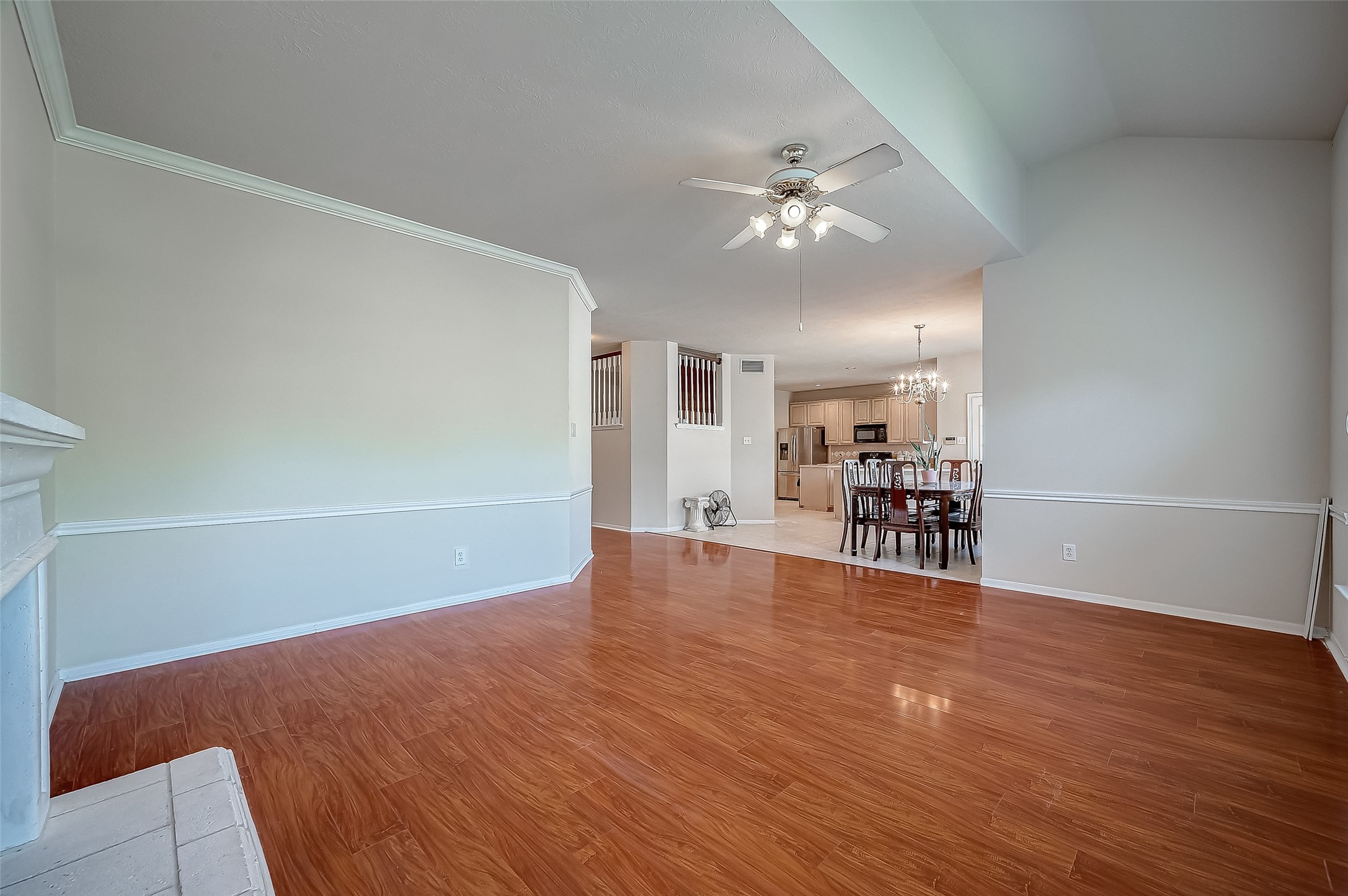2907 Little Branch Court Houston, TX 77082 - Photo 13 of 50 a view of an empty room with wooden floor and a ceiling fan