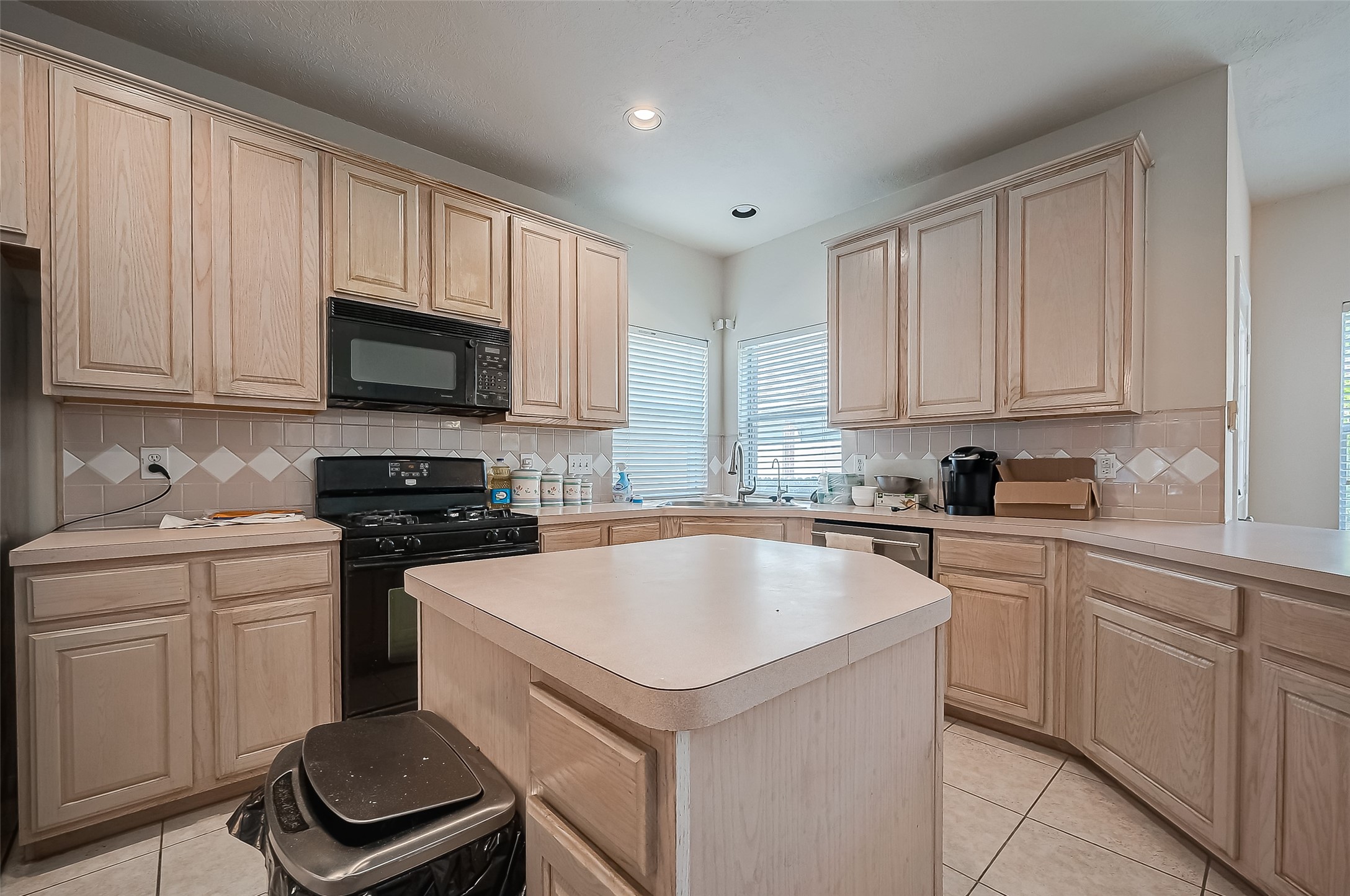 2907 Little Branch Court Houston, TX 77082 - Photo 19 of 50 a kitchen with a sink stove top oven and cabinets