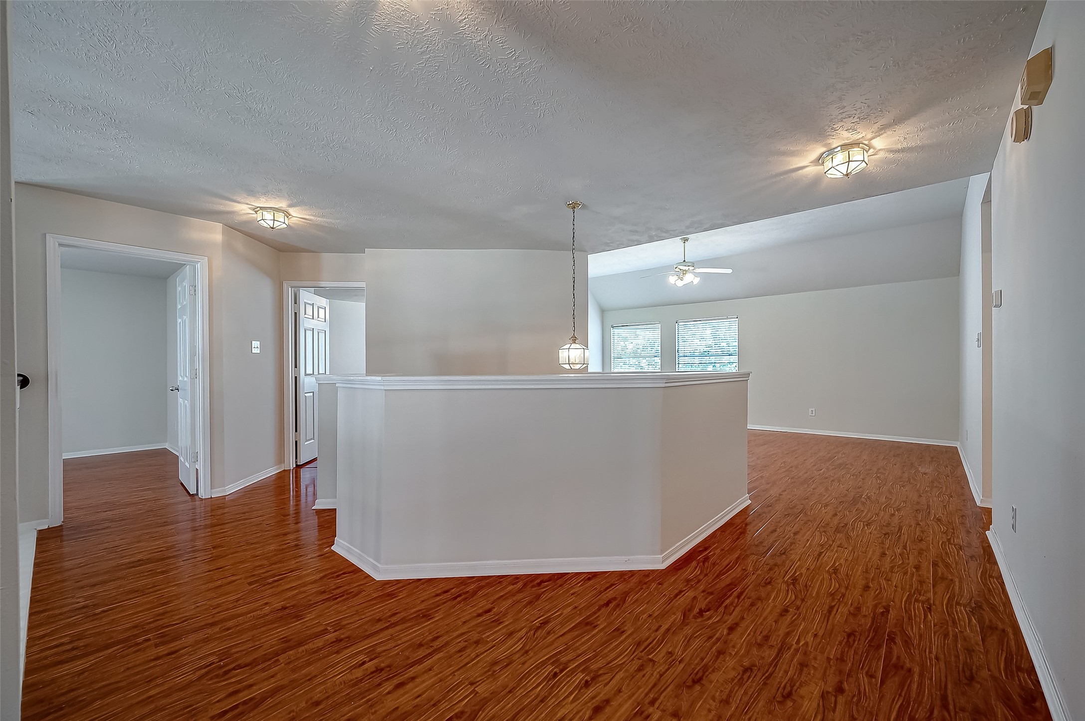 2907 Little Branch Court Houston, TX 77082 - Photo 26 of 50 a view of a big room with wooden floor and windows