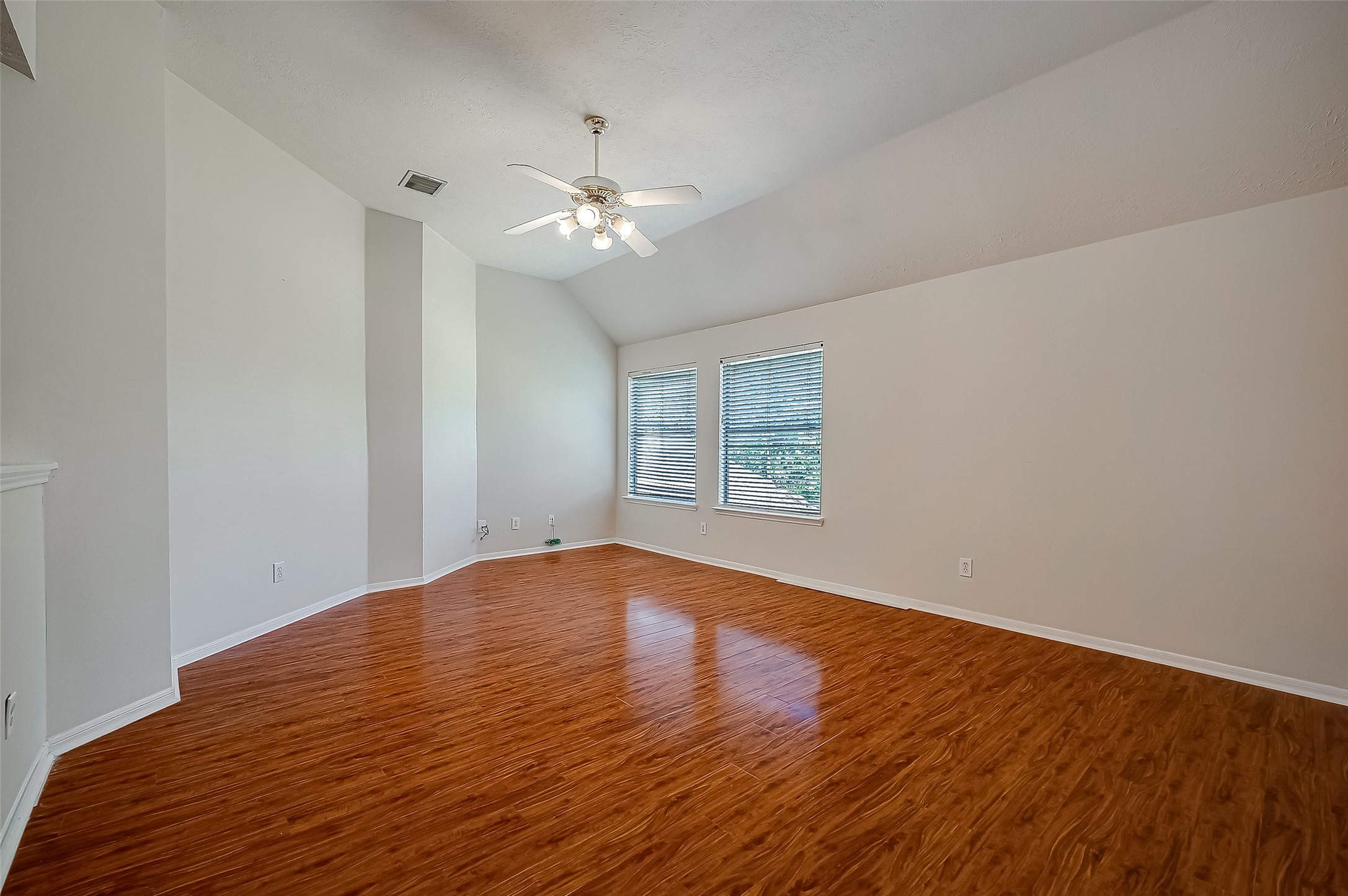 2907 Little Branch Court Houston, TX 77082 - Photo 34 of 50 a view of empty room with wooden floor and fan