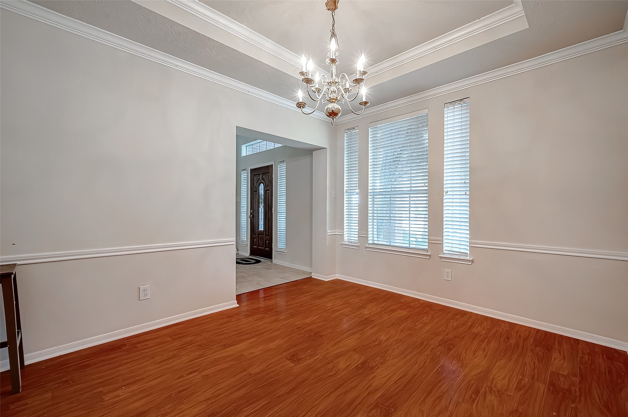2907 Little Branch Court Houston, TX 77082 - Photo 9 of 50 a view of an empty room with wooden floor and a window