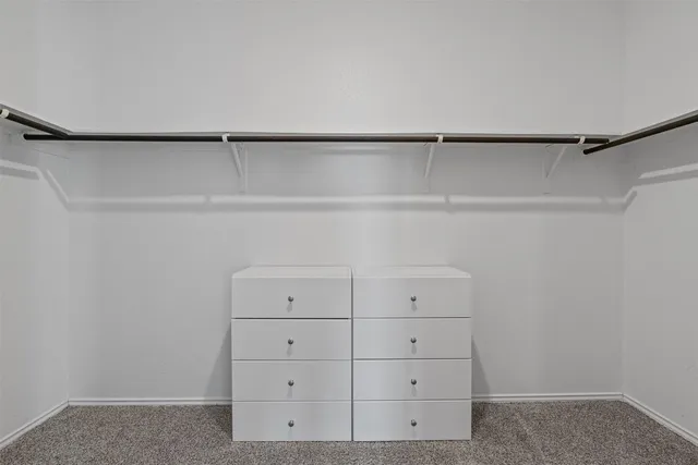 a white bath tub sitting next to a shower