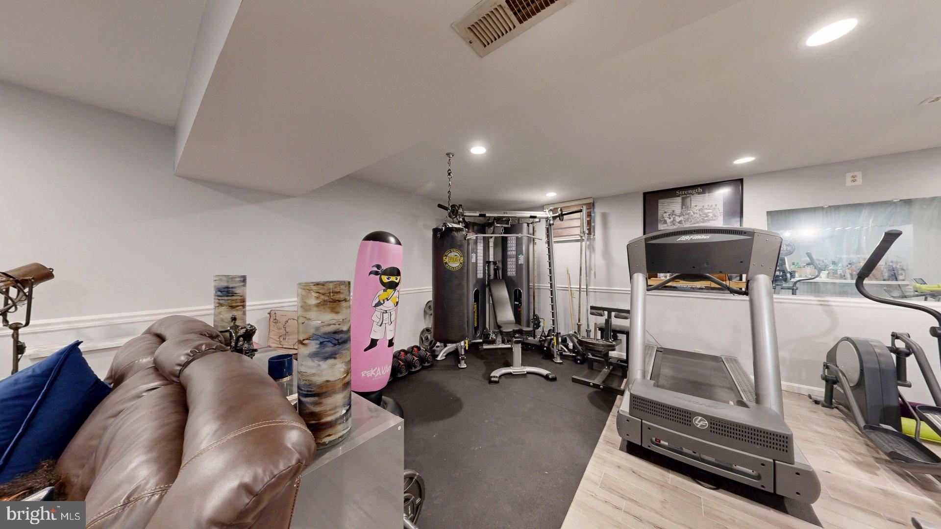 11901 Rustic Farm Court Germantown, MD 20874 - Photo 95 of 134 Home gym with diverse workout equipment.