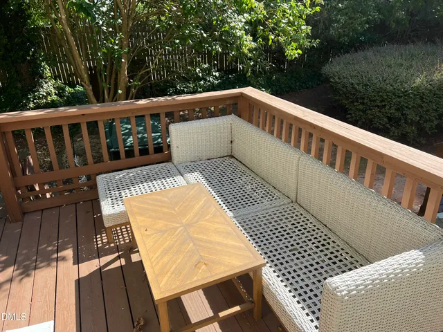 a view of balcony with wooden floor