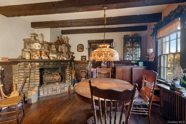 a dining room with furniture and window
