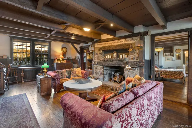 a dining room with furniture and a fireplace