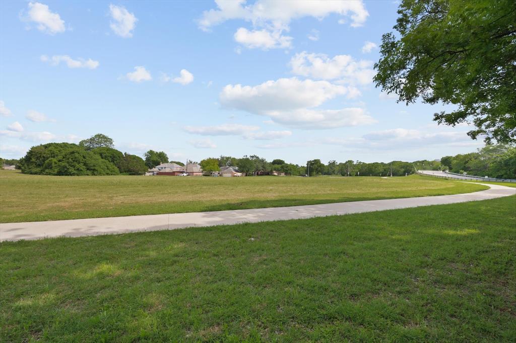 699 West Wintergreen Road DeSoto, TX 75115 - Photo 4 of 29 a view of a lake with a big yard