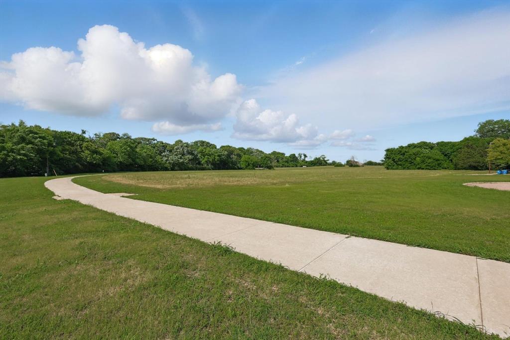 699 West Wintergreen Road DeSoto, TX 75115 - Photo 7 of 29 a view of a lake with a big yard