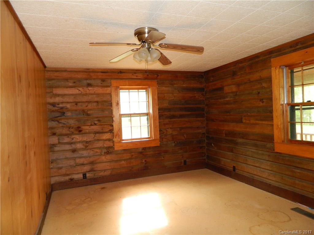 1111 McCurdy Road Hiddenite, NC 28636 - Photo 13 of 20 a view of a livingroom with a ceiling fan and window