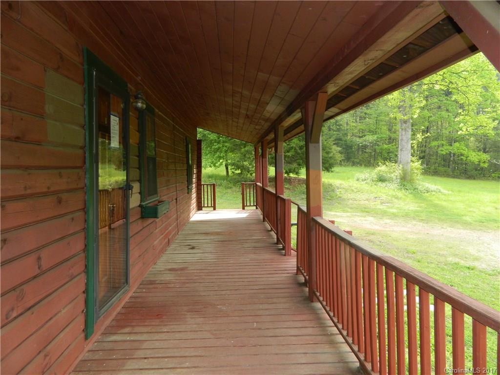 1111 McCurdy Road Hiddenite, NC 28636 - Photo 16 of 20 a view of a porch with wooden floor and stairs