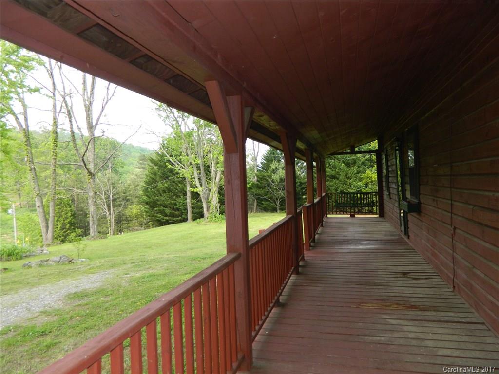 1111 McCurdy Road Hiddenite, NC 28636 - Photo 17 of 20 a view of a porch with wooden floor and outdoor space