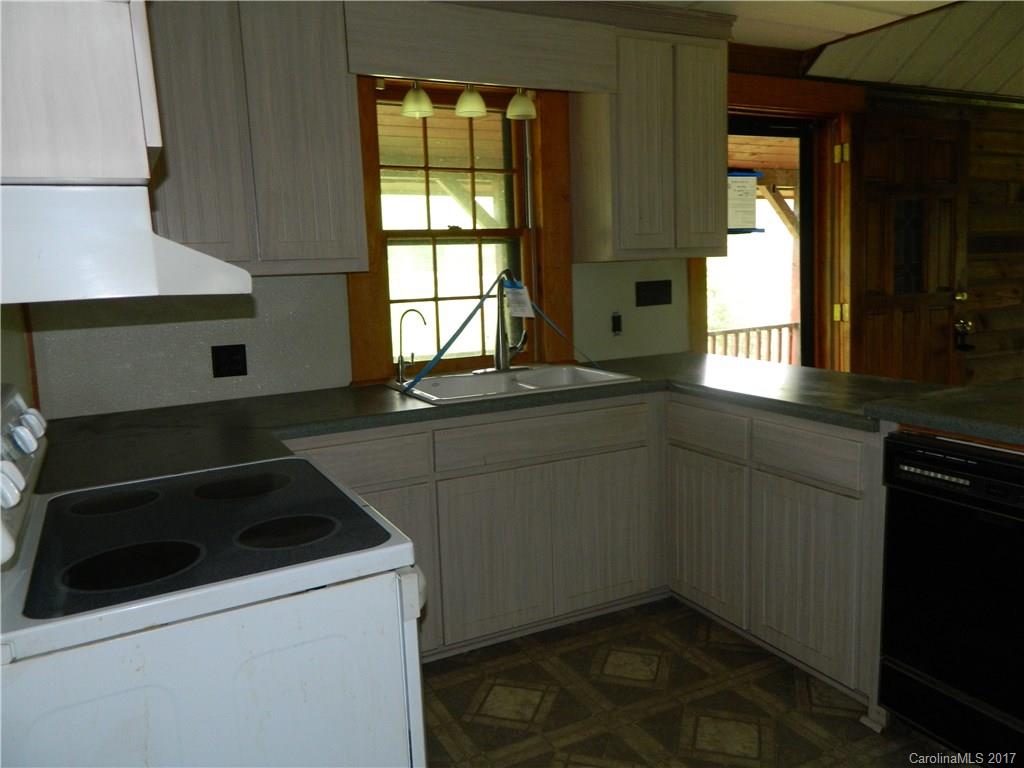 1111 McCurdy Road Hiddenite, NC 28636 - Photo 3 of 20 a kitchen that has a sink and a stove