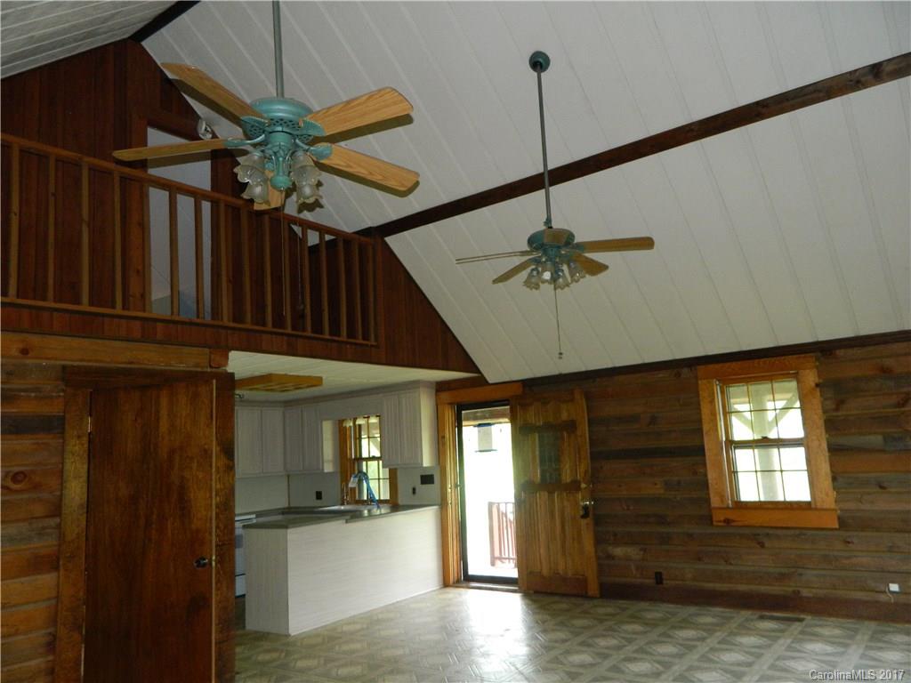 1111 McCurdy Road Hiddenite, NC 28636 - Photo 8 of 20 a view of a livingroom with a ceiling fan window and wooden floor