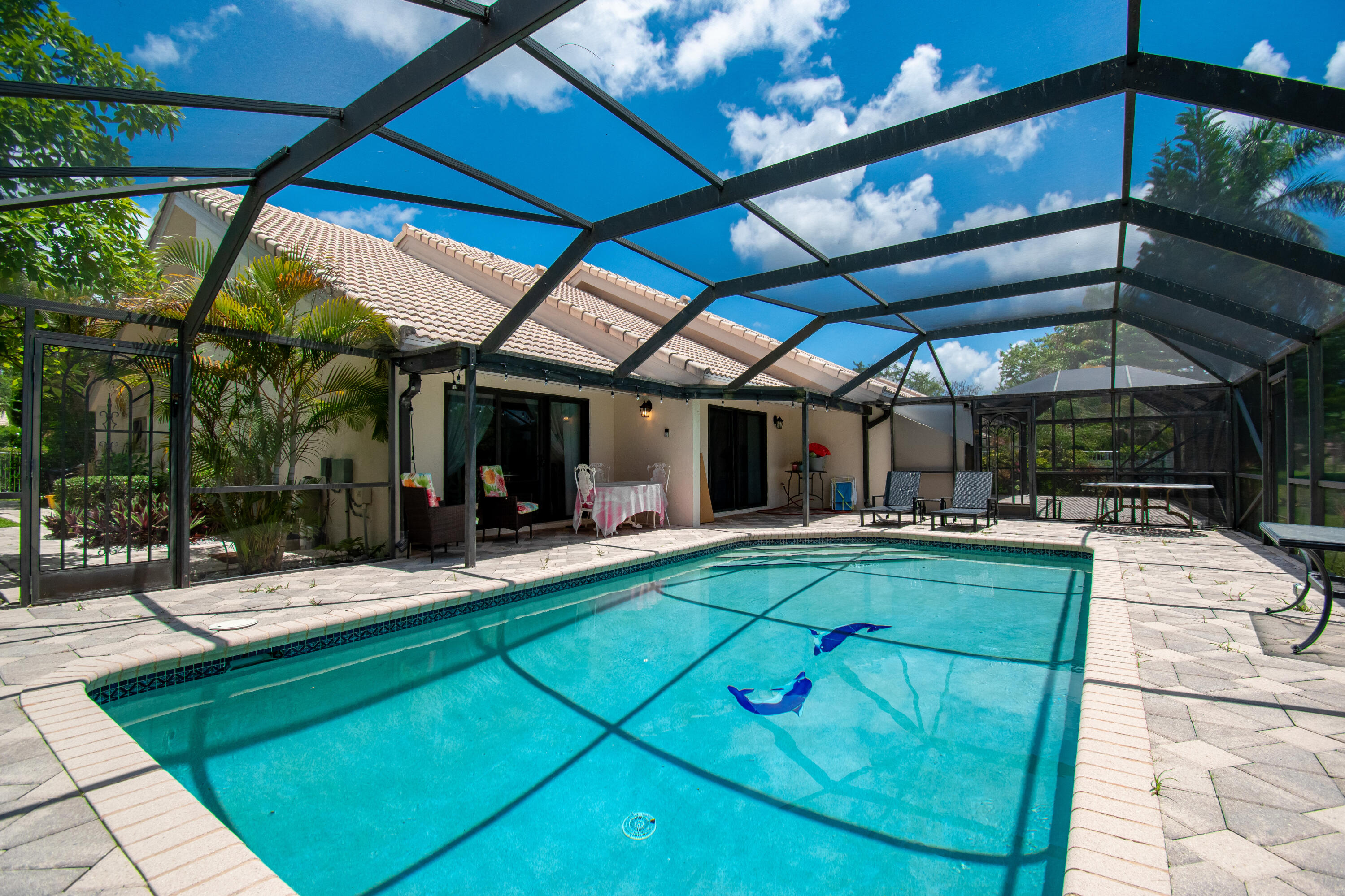 9708 Erica Court Boca Raton, FL 33496 - Photo 41 of 54 a view of a swimming pool with a patio