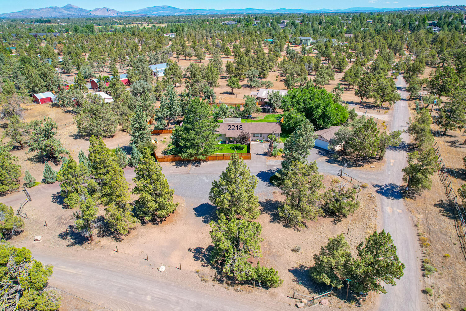 2218 Southwest 79th Street Redmond, OR 97756 - Photo 42 of 54 an aerial view of residential houses with outdoor space and trees