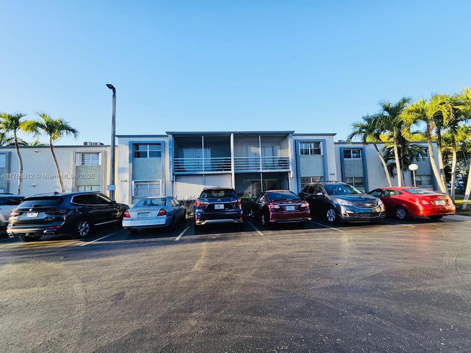 a view of a cars in front of a house