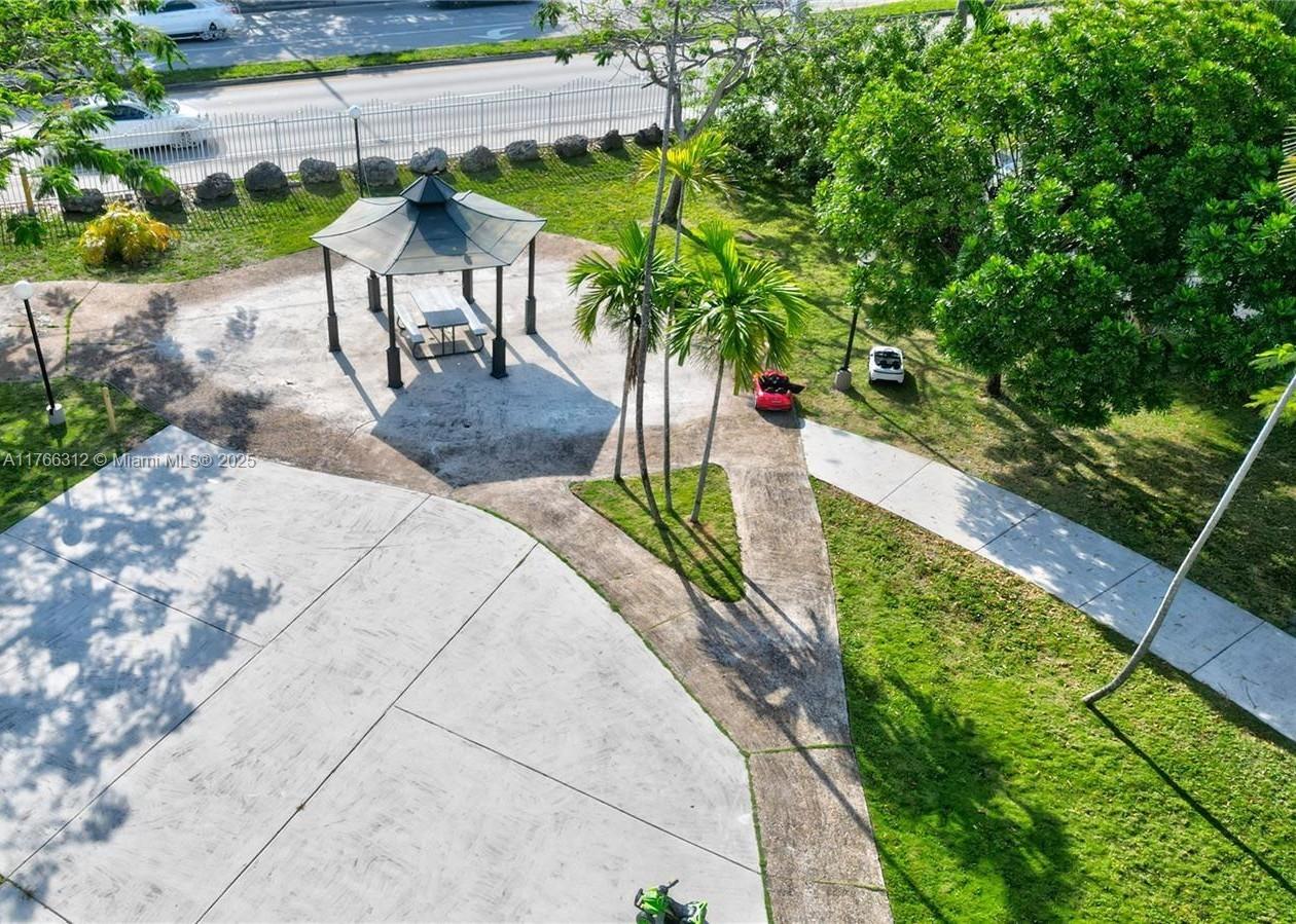 8788 Southwest 12th Street, Unit 103 Miami, FL 33174 - Photo 12 of 15 a picture of a table and chairs in patio