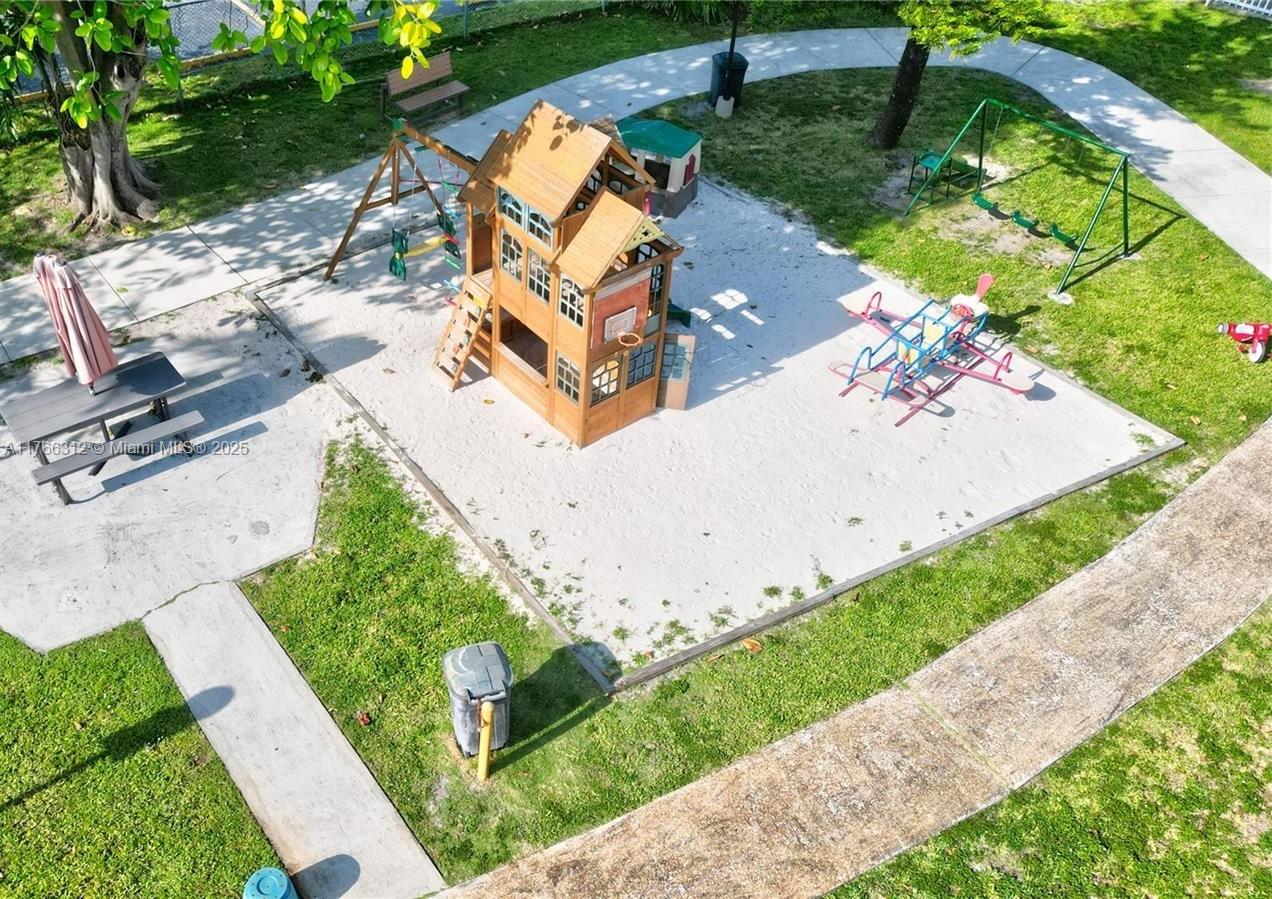 8788 Southwest 12th Street, Unit 103 Miami, FL 33174 - Photo 13 of 15 an aerial view of a house with a yard and potted plants