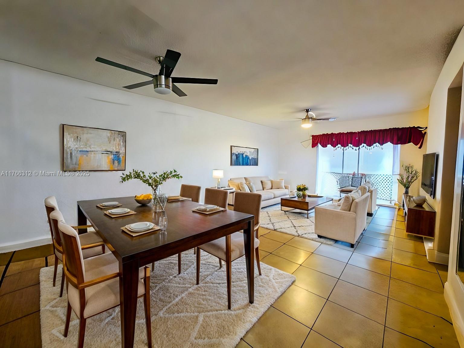 8788 Southwest 12th Street, Unit 103 Miami, FL 33174 - Photo 4 of 15 a view of a livingroom with furniture and a table
