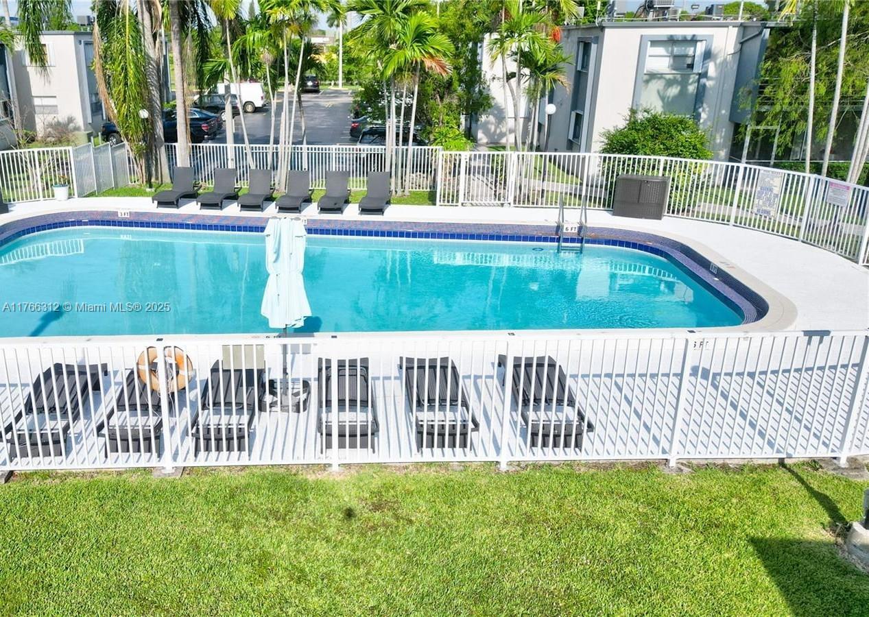8788 Southwest 12th Street, Unit 103 Miami, FL 33174 - Photo 9 of 15 a view of a backyard with a small pool