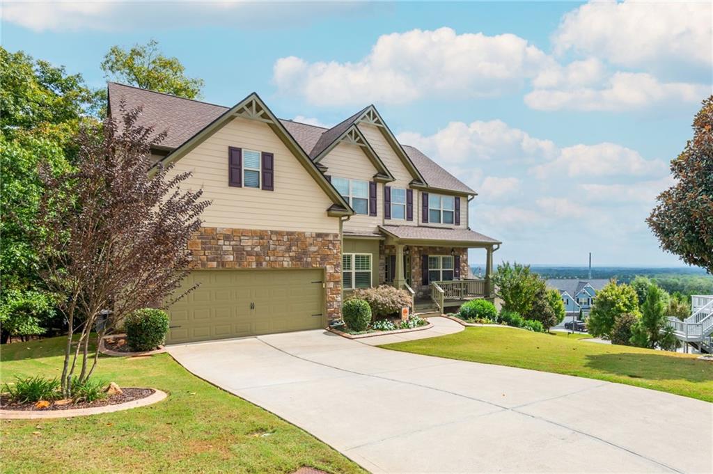 407 Ward Farm Drive Powder Springs, GA 30127 - Photo 1 of 67 a front view of a house with a yard and garage
