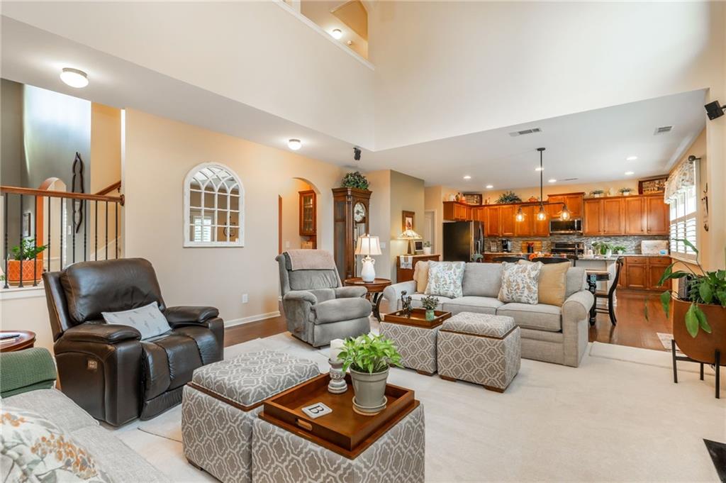 407 Ward Farm Drive Powder Springs, GA 30127 - Photo 15 of 67 a living room with furniture kitchen view and a large window