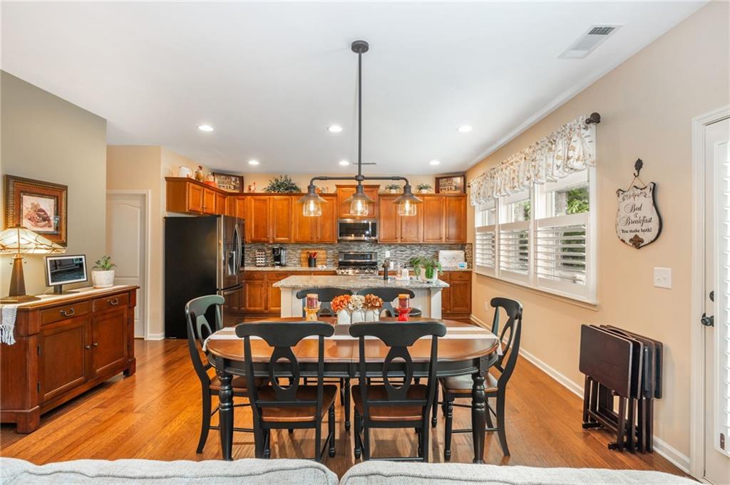 407 Ward Farm Drive Powder Springs, GA 30127 - Photo 16 of 67 a dining room with furniture and window