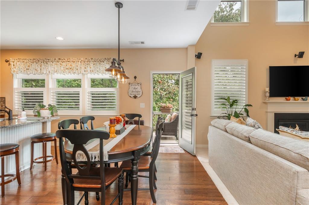 407 Ward Farm Drive Powder Springs, GA 30127 - Photo 20 of 67 a view of a dining room with furniture window and wooden floor