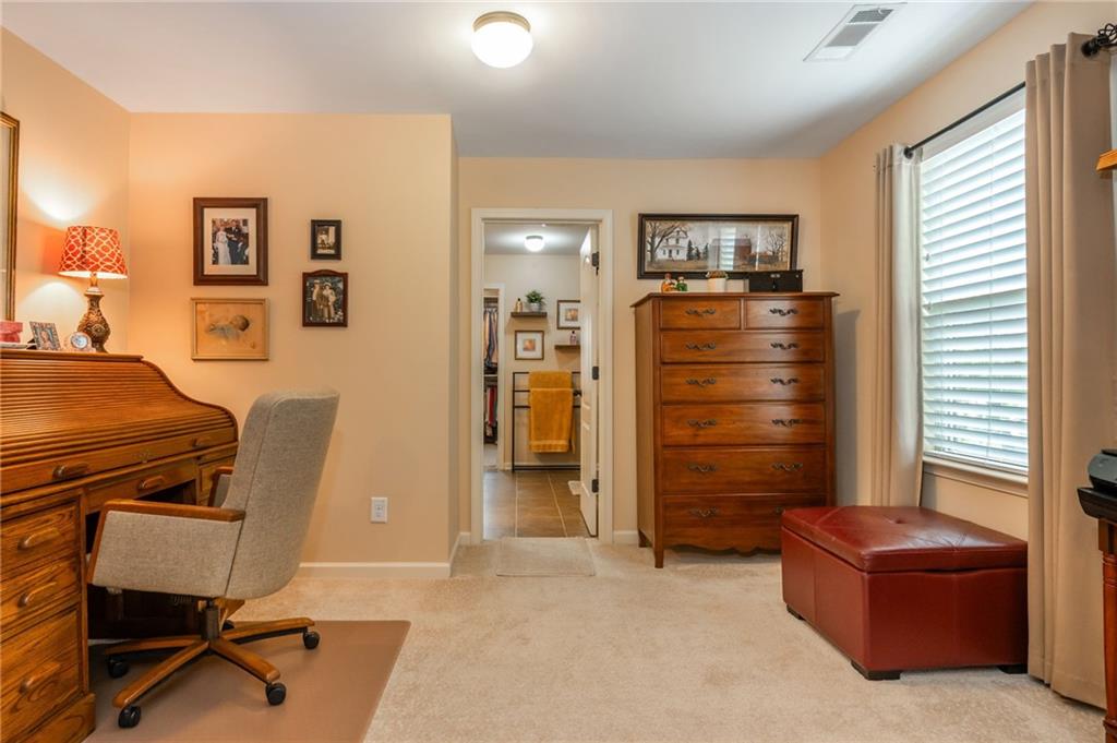 407 Ward Farm Drive Powder Springs, GA 30127 - Photo 35 of 67 a room with furniture and a dresser