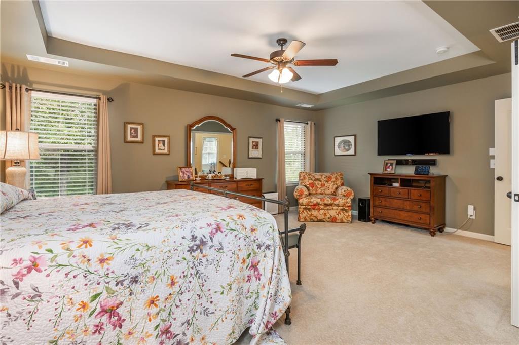 407 Ward Farm Drive Powder Springs, GA 30127 - Photo 37 of 67 a bedroom with a bed and a flat screen tv