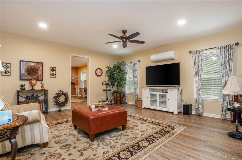 407 Ward Farm Drive Powder Springs, GA 30127 - Photo 46 of 67 a living room with furniture and a flat screen tv