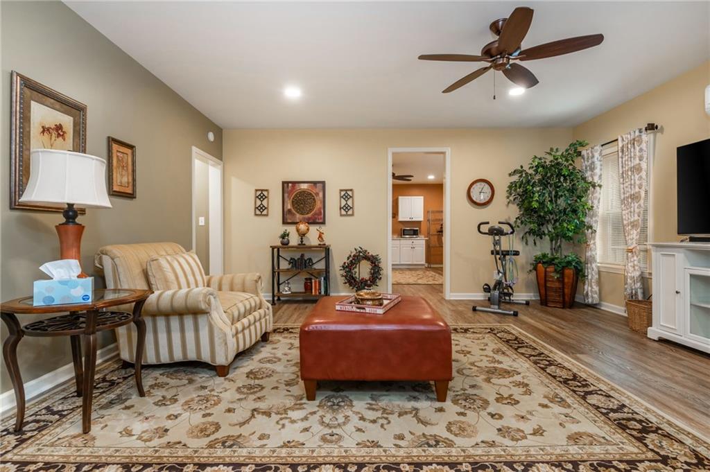 407 Ward Farm Drive Powder Springs, GA 30127 - Photo 47 of 67 a living room with furniture and wooden floor
