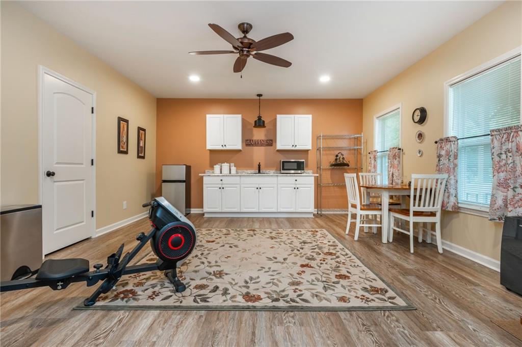 407 Ward Farm Drive Powder Springs, GA 30127 - Photo 50 of 67 a living room with furniture and a table