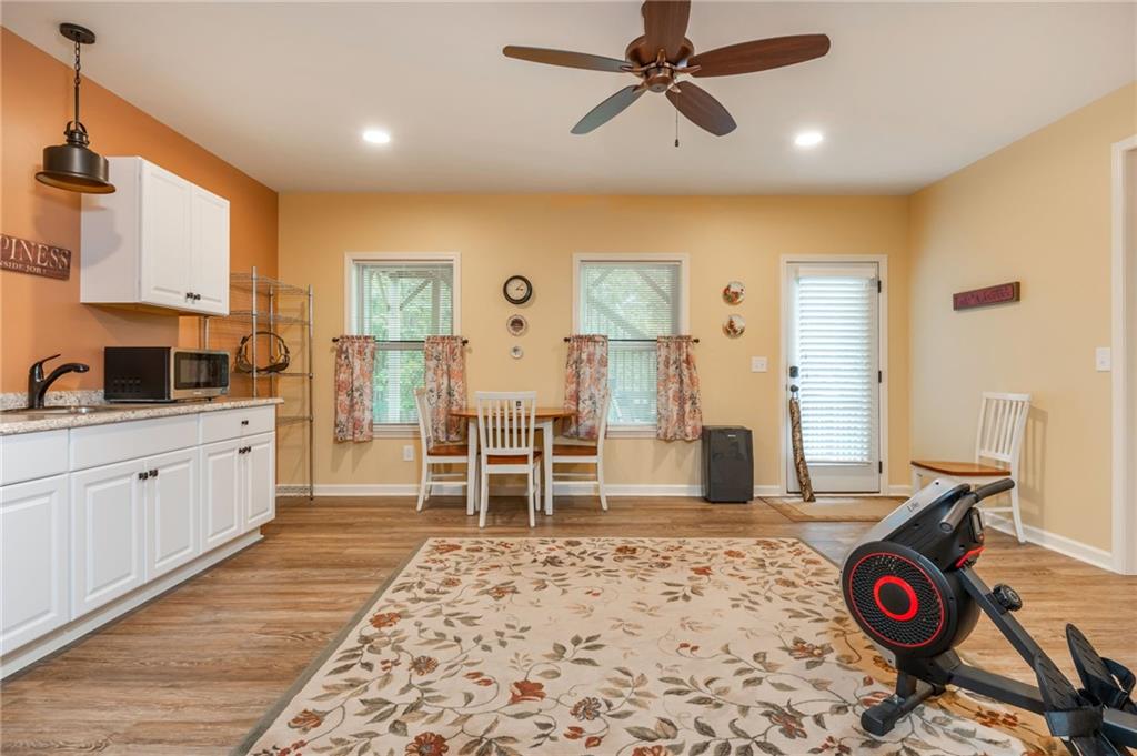 407 Ward Farm Drive Powder Springs, GA 30127 - Photo 51 of 67 a very nice looking dining room with wooden floor and a fireplace