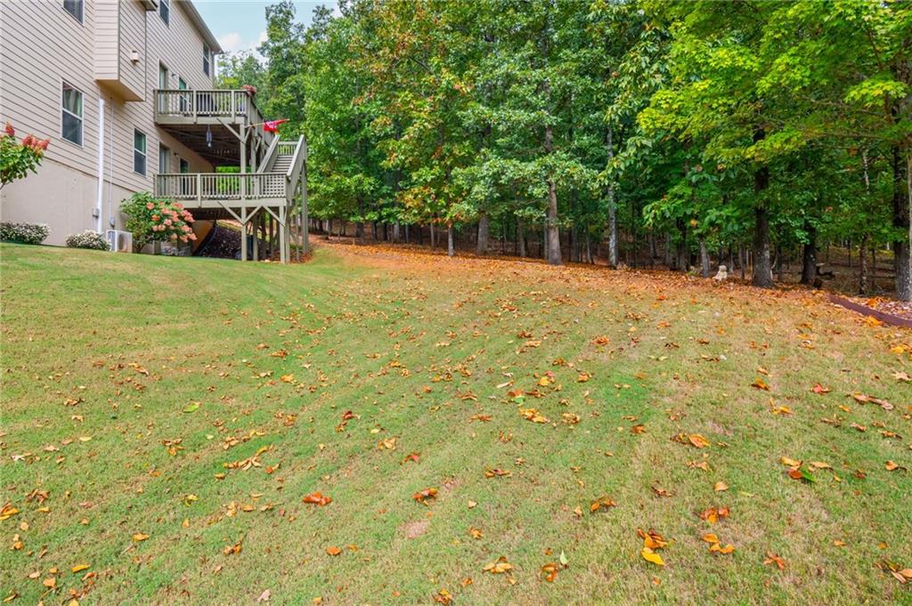 407 Ward Farm Drive Powder Springs, GA 30127 - Photo 54 of 67 a view of a yard in front of a building