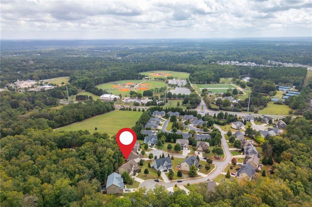 407 Ward Farm Drive Powder Springs, GA 30127 - Photo 63 of 67 an aerial view of residential houses with outdoor space and swimming pool