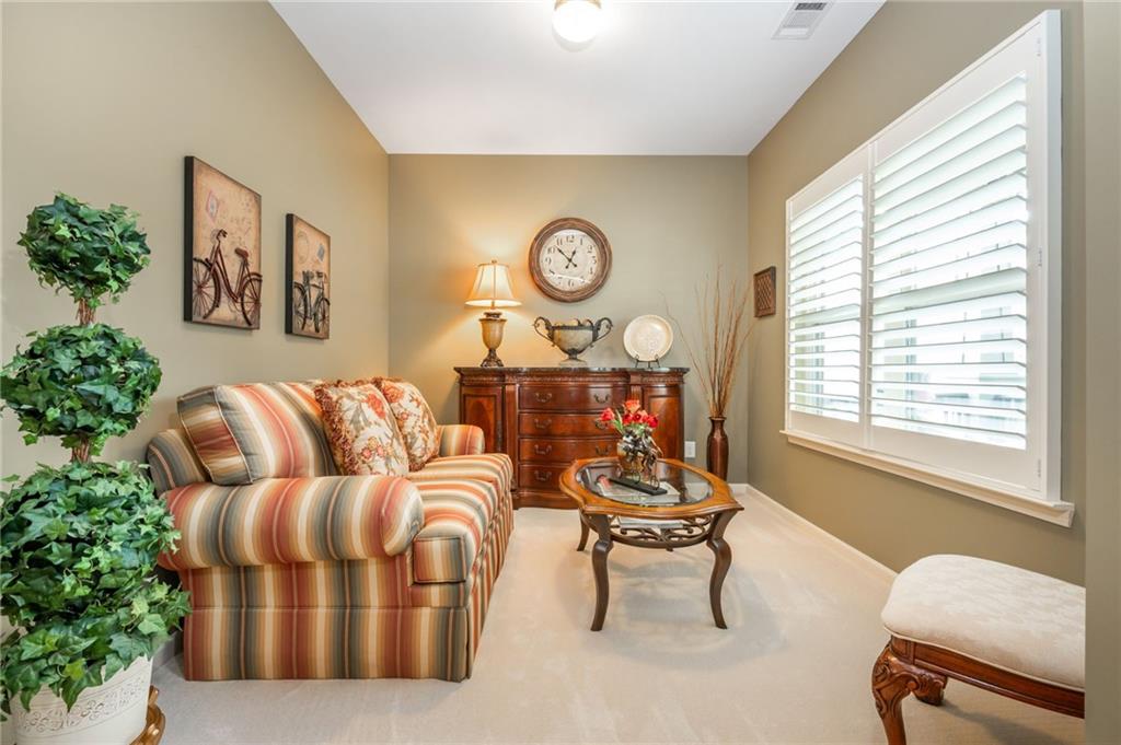 407 Ward Farm Drive Powder Springs, GA 30127 - Photo 8 of 67 a living room with furniture and a window