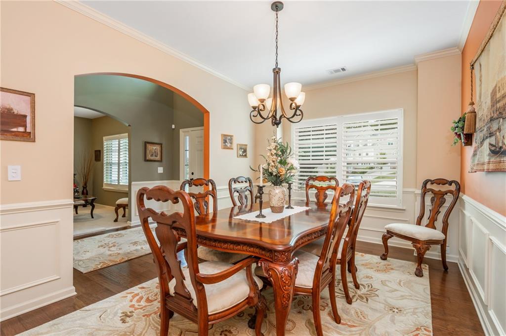 407 Ward Farm Drive Powder Springs, GA 30127 - Photo 10 of 67 a view of a dining room with furniture and wooden floor