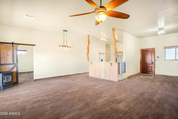 an empty room with windows and entrance