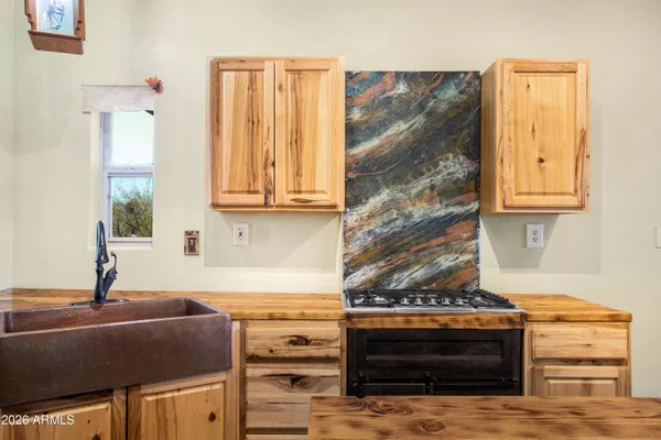 a kitchen with a sink and a stove